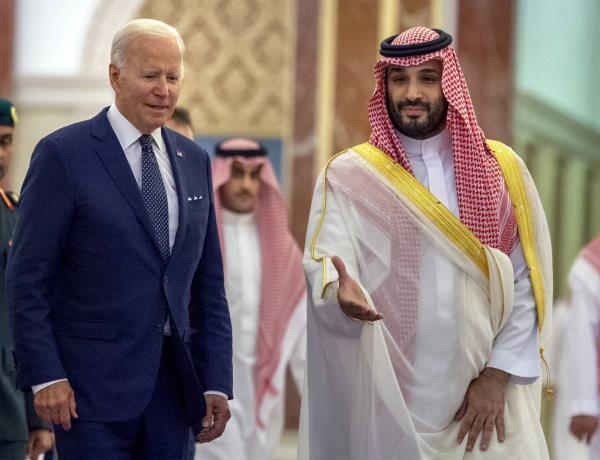 FILE - In this photo released by the Saudi Royal Palace, Saudi Crown Prince Mohammed bin Salman, right, welcomes U.S. President Joe Biden to Al-Salam Palace in Jeddah, Saudi Arabia, July 15, 2022. 