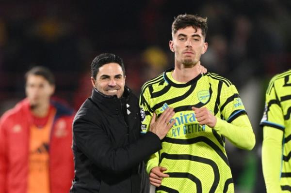 Mikel Arteta, Manager of Arsenal, celebrates with Kai Havertz following the team's victory during the Premier League match between Brentford FC and Arsenal FC at Gtech Community Stadium.